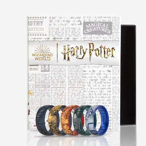 Image of Harry Potter Collection Bundle - 5 ring set in a Harry Potter branded box. Gryffindor, Metallic warm golden yellow and deep, true red with hints of shimmer. Ravenclaw, Metallic warm golden yellow and deep, true red with hints of shimmer. Hufflepuff, Metallic warm golden yellow and metallic true black. Slytherin, Metallic dark Gray with hints of silver and iridescent deep forest green. Deathly Hallows, Metallic true black..